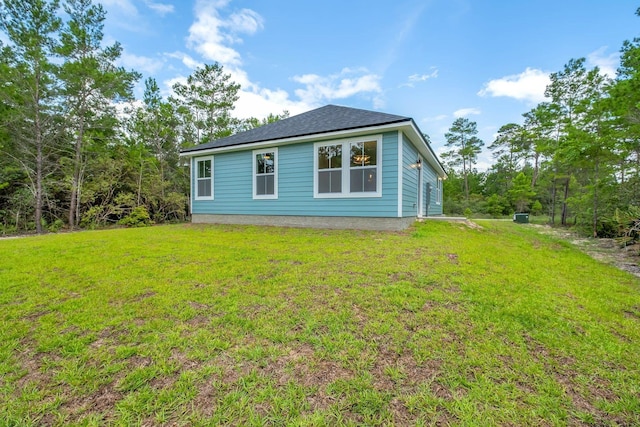 1695 Landing St, Carrabelle, FL 32322 - rear view of property featuring a yard