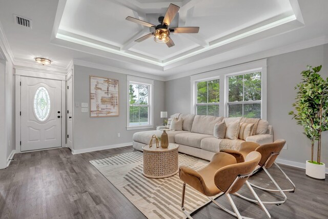 1695 Landing St, Carrabelle, FL 32322 - living area with healthy amount of natural light, coffered ceiling, a ceiling fan, dark wood-type flooring, and crown molding