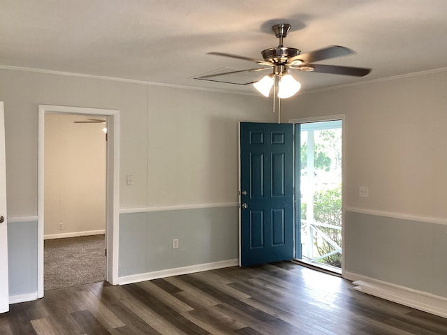 entryway featuring ceiling fan, dark hardwood / wood-style flooring, and crown molding