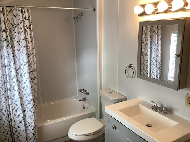 full bathroom with vanity, toilet, and shower / tub combo