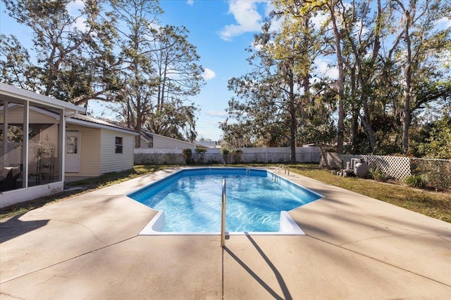 view of swimming pool with a patio area