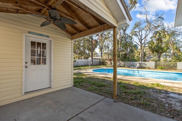 exterior space with ceiling fan and a patio