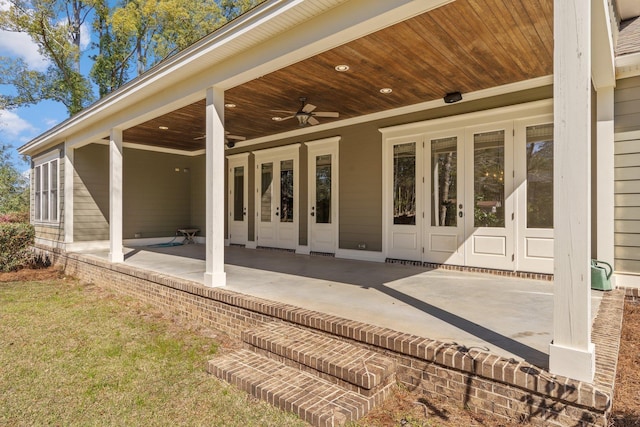 exterior space featuring a ceiling fan, a patio, and french doors