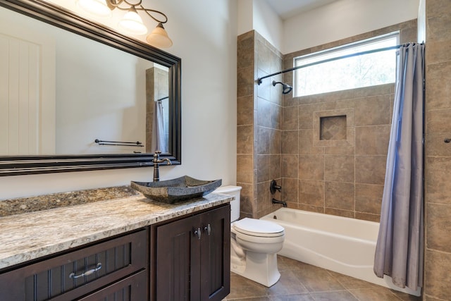 bathroom with vanity, shower / bath combination with curtain, toilet, and tile patterned floors