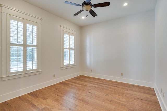 spare room with light wood-style floors, ceiling fan, baseboards, and recessed lighting