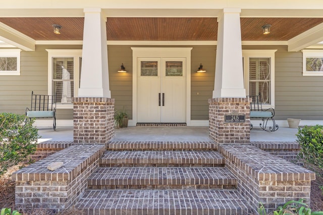 doorway to property with covered porch