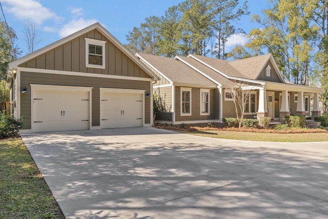 craftsman-style home featuring driveway, a shingled roof, board and batten siding, and an attached garage