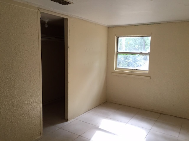 unfurnished bedroom with a closet