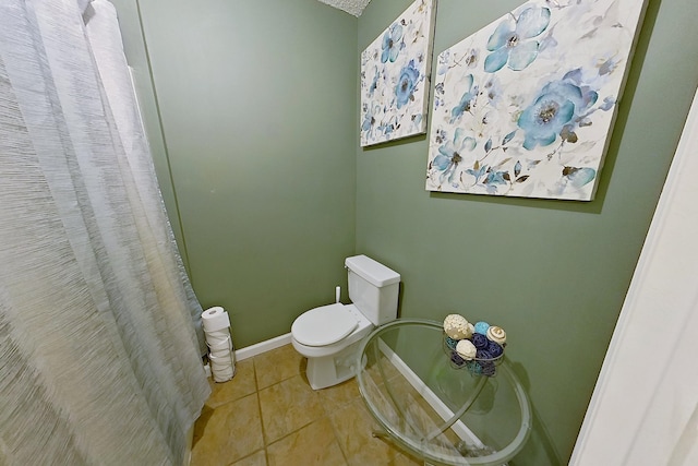 273 Old Timey Trl, Moultrie, GA 31788 - bathroom with tile patterned flooring, toilet, curtained shower, and baseboards