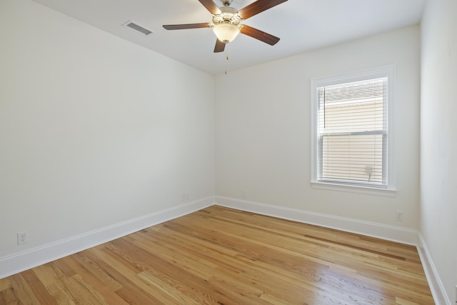 spare room featuring ceiling fan and light hardwood / wood-style flooring