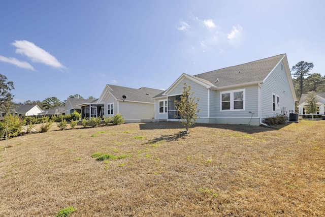 exterior space featuring central AC and a lawn