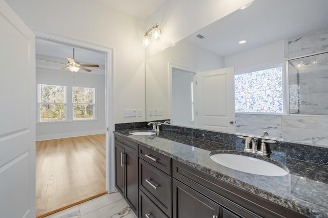 bathroom featuring vanity, plenty of natural light, and ceiling fan