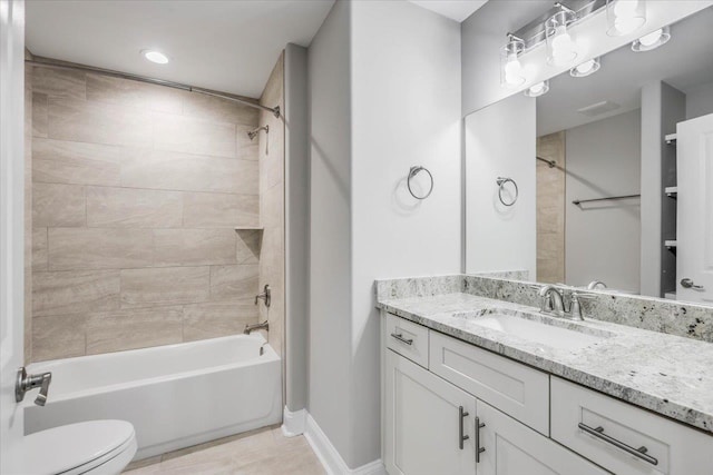 full bathroom with tiled shower / bath, vanity, toilet, and tile patterned flooring