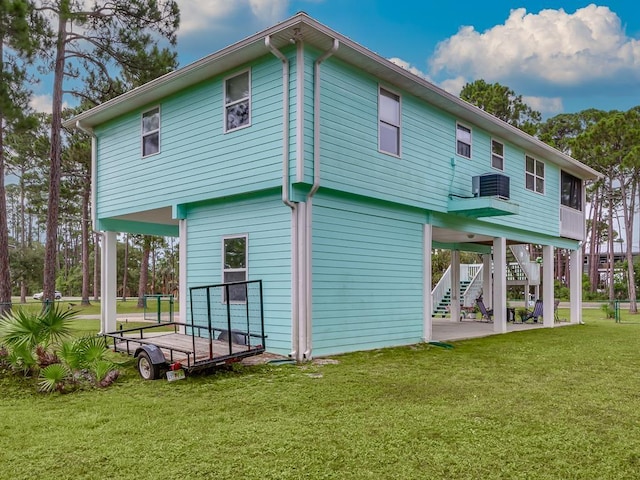 back of house with a yard