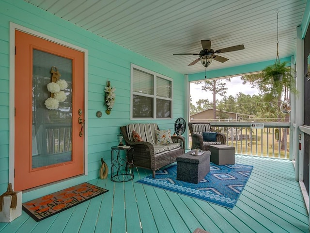 deck featuring a porch and ceiling fan