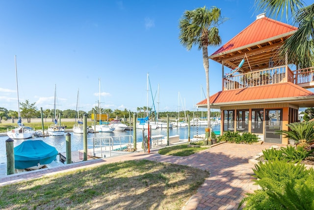 view of dock with a water view and a balcony