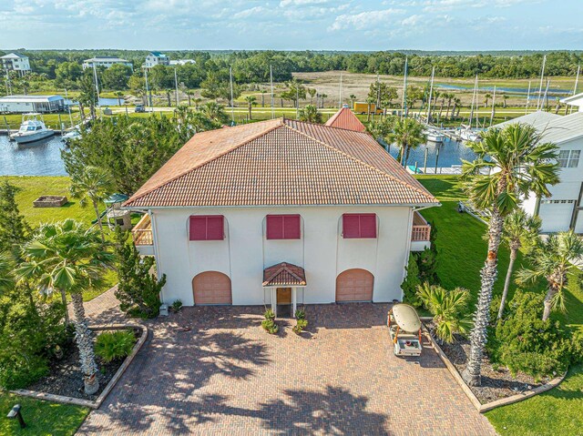 view of front of home with a water view