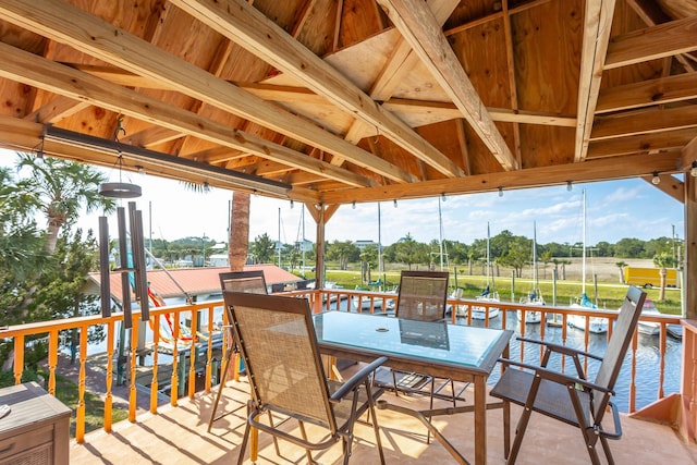 wooden deck featuring a water view