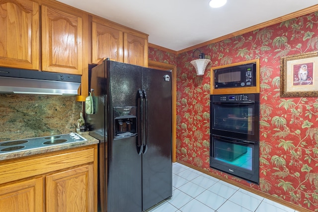 kitchen with black appliances and light tile patterned floors