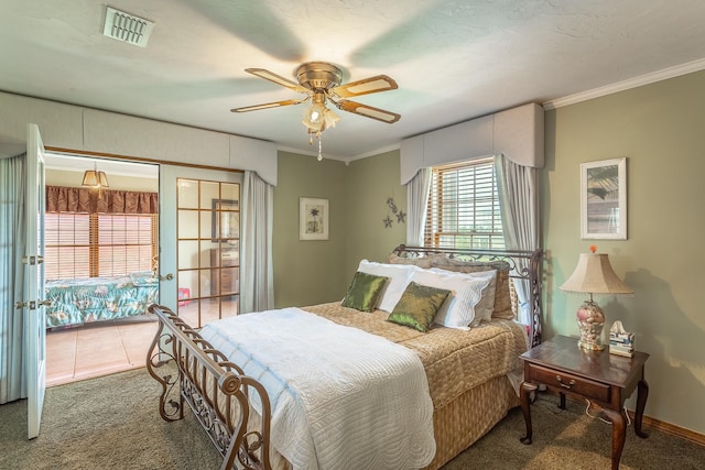 carpeted bedroom featuring ceiling fan and crown molding