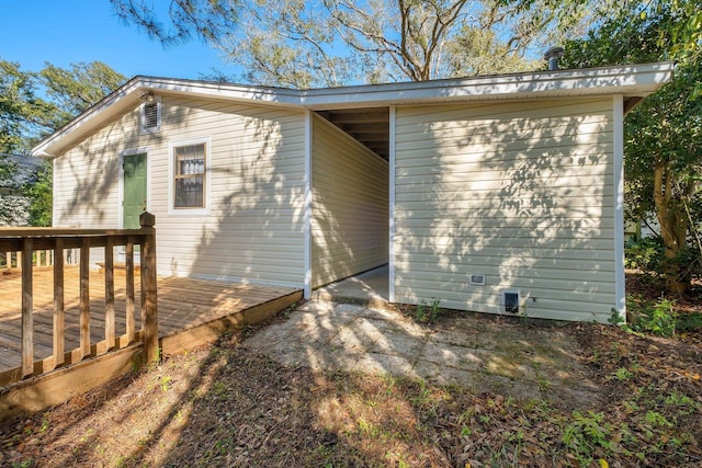 exterior space with a deck and crawl space