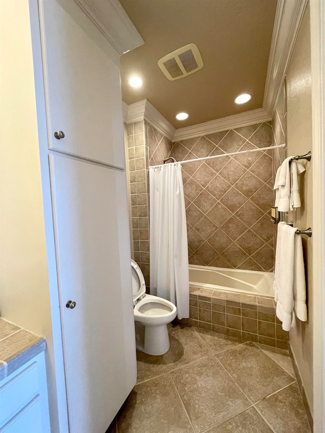 full bathroom featuring toilet, tile patterned floors, vanity, crown molding, and shower / tub combo