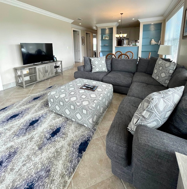 tiled living room featuring an inviting chandelier and crown molding