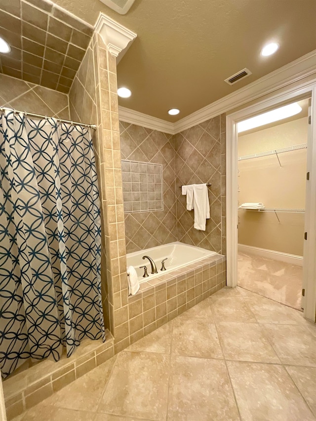 bathroom with tile patterned floors, crown molding, and plus walk in shower