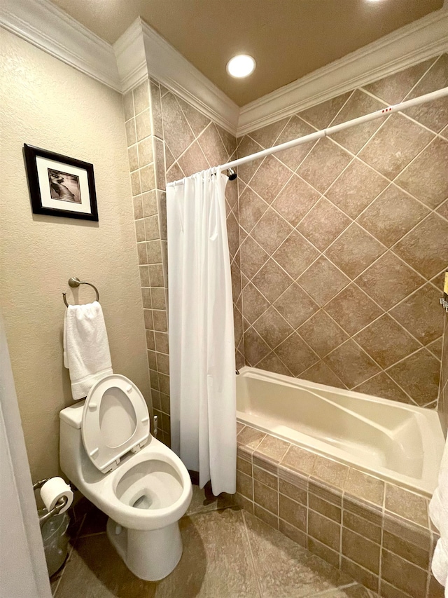 bathroom featuring shower / bath combo, toilet, and ornamental molding