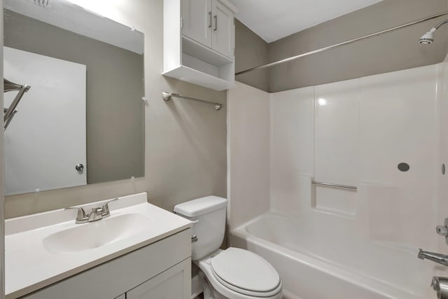 full bathroom featuring vanity, washtub / shower combination, and toilet