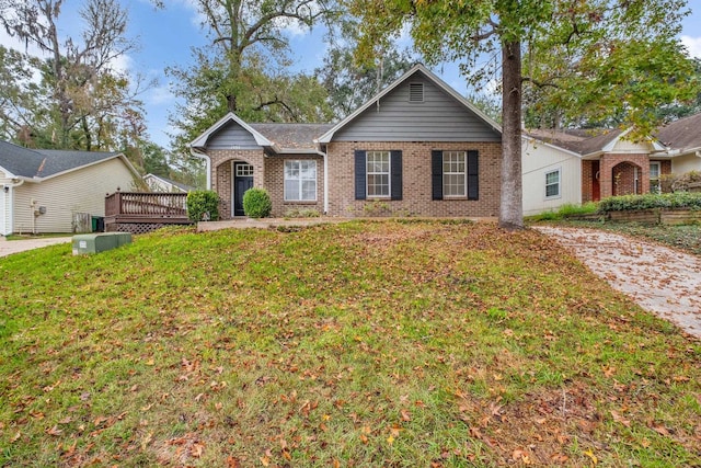 ranch-style house with a wooden deck and a front lawn