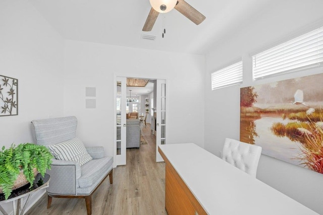 sitting room with ceiling fan and light hardwood / wood-style flooring