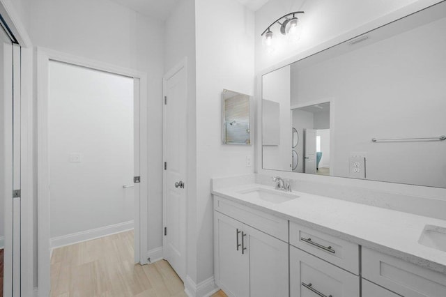 bathroom featuring vanity and wood-type flooring