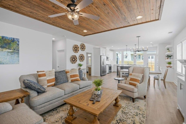 living room with wood ceiling, ceiling fan with notable chandelier, and light hardwood / wood-style flooring