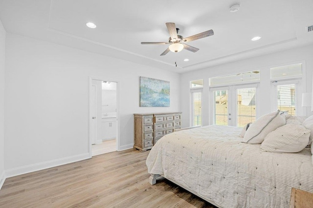 bedroom with french doors, access to outside, ensuite bath, ceiling fan, and light hardwood / wood-style flooring