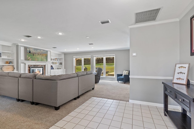 living area with visible vents, light colored carpet, and a glass covered fireplace