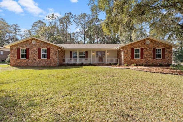 ranch-style home with brick siding, a front lawn, and a porch