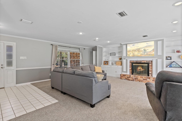 tiled living room with built in shelves, a brick fireplace, visible vents, and ornamental molding