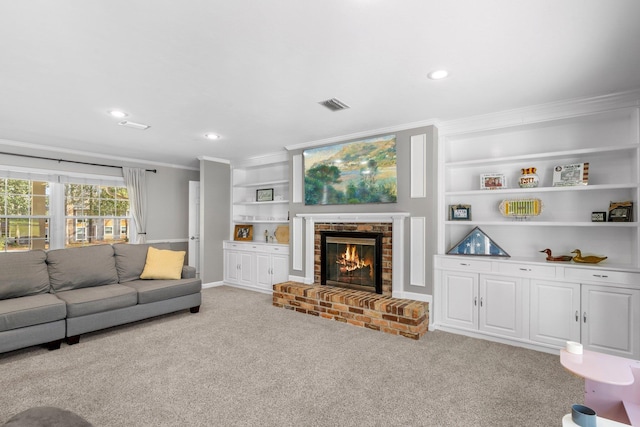 living room featuring carpet floors, a brick fireplace, visible vents, and crown molding