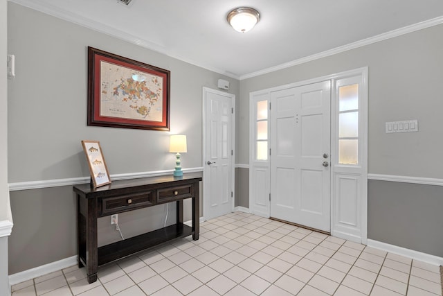 entrance foyer with baseboards, light tile patterned flooring, and crown molding