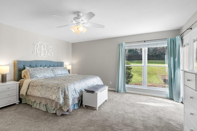 bedroom with baseboards, a ceiling fan, and carpet flooring