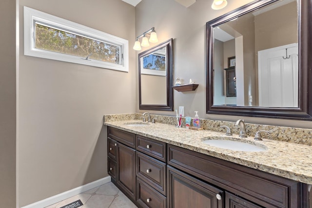 bathroom with vanity and tile patterned flooring