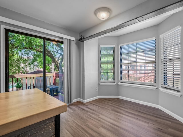 420 Indian Village Trl, Tallahassee, FL 32304 - unfurnished dining area with wood finished floors, healthy amount of natural light, and baseboards