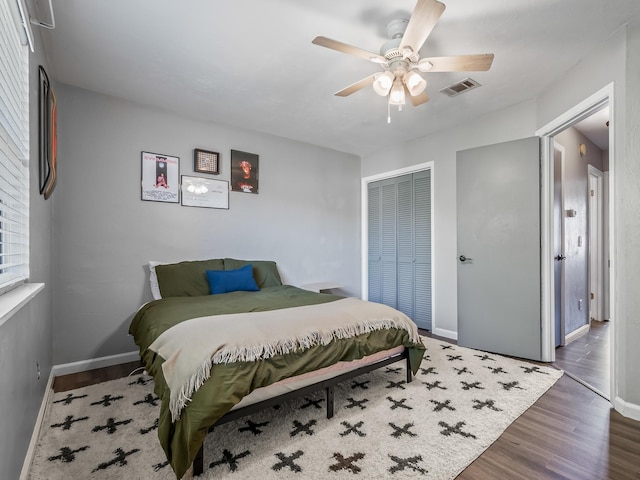 420 Indian Village Trl, Tallahassee, FL 32304 - bedroom featuring wood finished floors, a closet, baseboards, and a ceiling fan