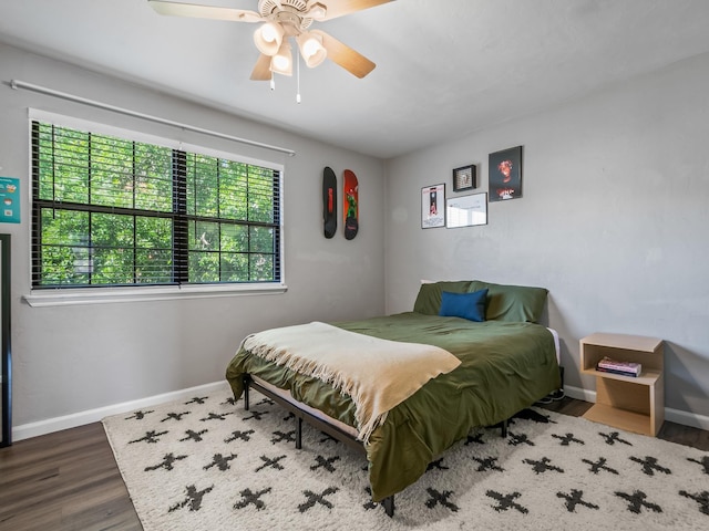 420 Indian Village Trl, Tallahassee, FL 32304 - bedroom with baseboards, wood finished floors, and ceiling fan