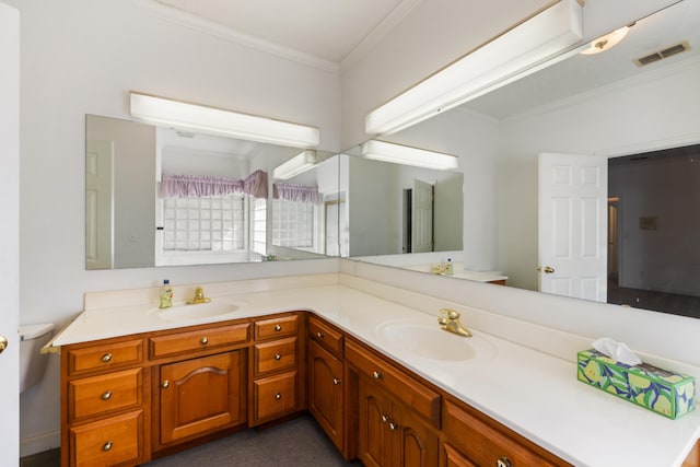 bathroom with ornamental molding and vanity