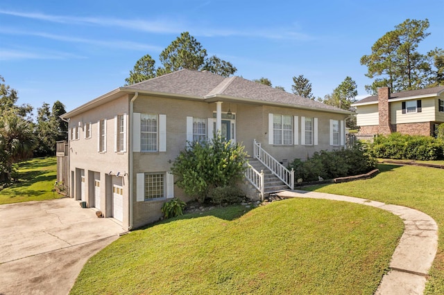 view of front of home featuring a garage and a front lawn