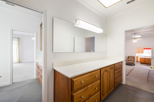 bathroom featuring ornamental molding and ceiling fan