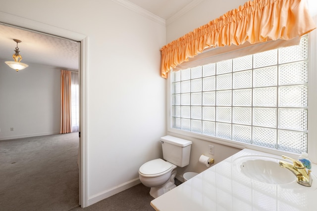 bathroom featuring ornamental molding, vanity, and toilet