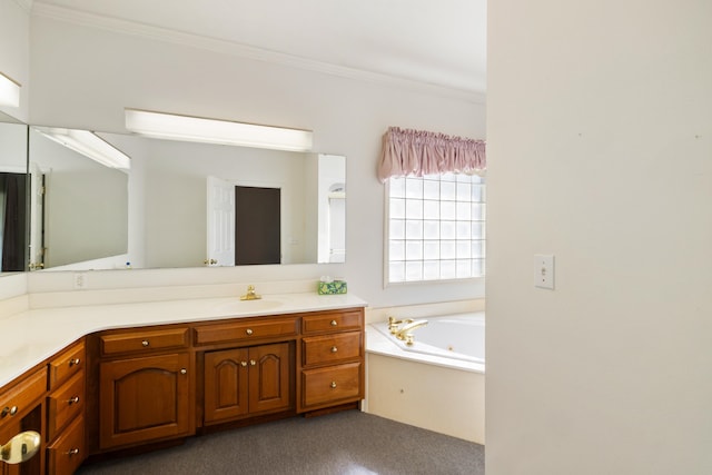 bathroom with vanity, a bathtub, and ornamental molding